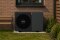 Viessmann heatpump outdoor unit in front of a house wall